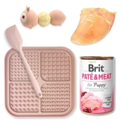 Sjovt sæt til din hvalp som indeholder både slikkeplade, hvalpelegetøj, vådfoder og en kalveklov.